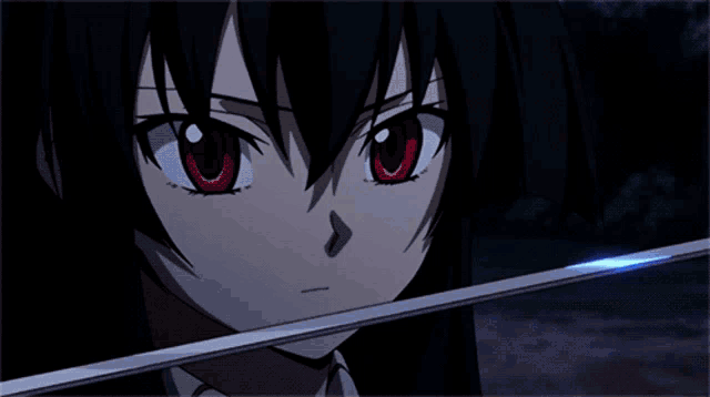 a close up of a girl with red eyes holding a sword