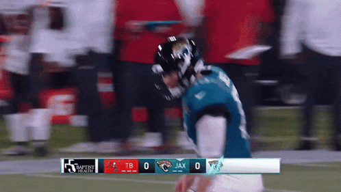 a football game is being played between the jaguars and the buccaneers