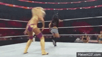 two women are wrestling in a ring with makeagif.com at the bottom of the screen