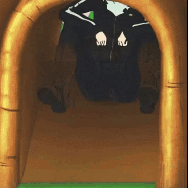 a person in a black jacket is sitting on a wooden slide