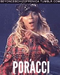 a woman wearing a plaid shirt and a hat is standing in front of a sign that says poracci