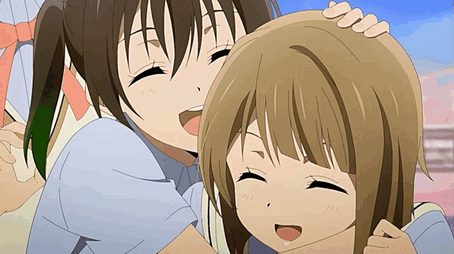 two anime girls are hugging each other and laughing