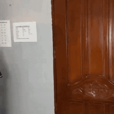 a wooden door with a sign that says laundry schedule