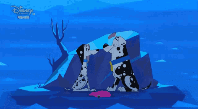 two dalmatian dogs standing next to each other with a disney premiere advertisement in the background