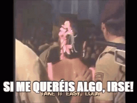 a group of people are standing in a crowd with the words `` si me quereis algo , irse ! ``