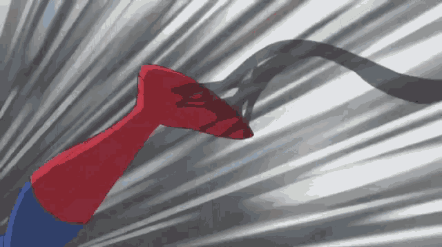 a spider-man 's arm is being swung by a black object