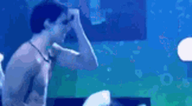 a man and a woman are dancing in a club .