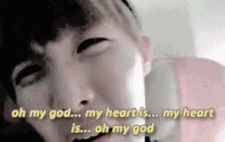 a close up of a person 's face with the words `` oh my god my heart is ... my heart is ... oh my god ''