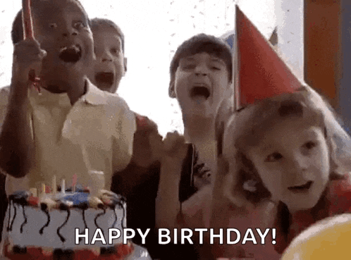 a group of children are celebrating their birthday with a cake and candles .