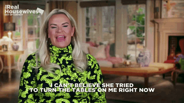 a woman in a neon green turtleneck says i can 't believe she tried to turn the tables on me