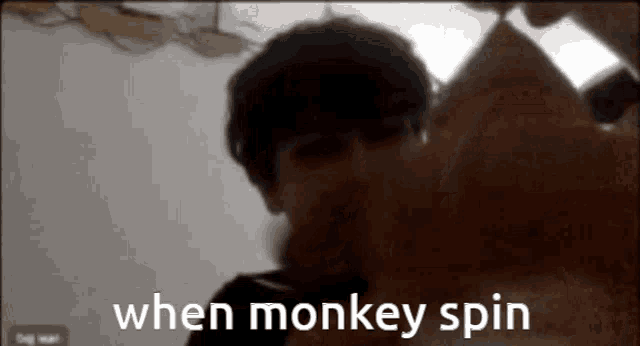 a monkey is spinning a piece of paper with the words when monkey spin written below it