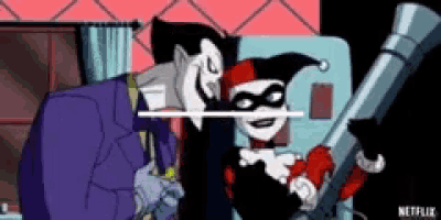 harley quinn and the joker are standing next to each other in a room . harley is holding a telescope .