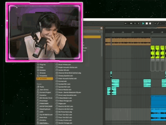a woman wearing headphones is laughing in front of a computer screen with a pink frame that says ' mixer '