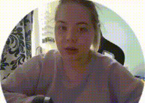 a woman in a purple sweater is sitting in front of a window in a circle .