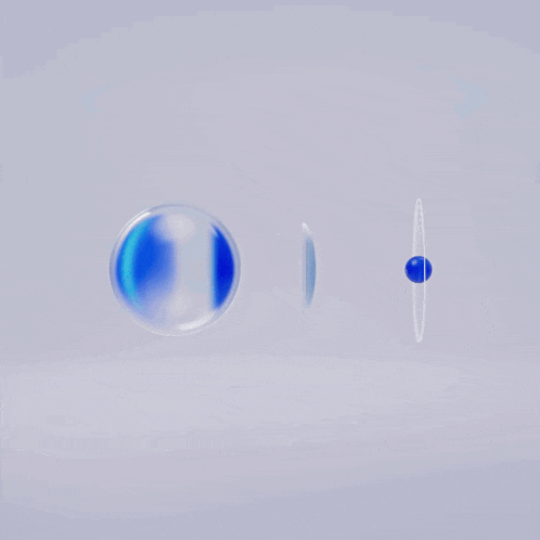 two blue spheres and a white circle on a white surface