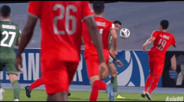 a soccer player with the number 26 on his back