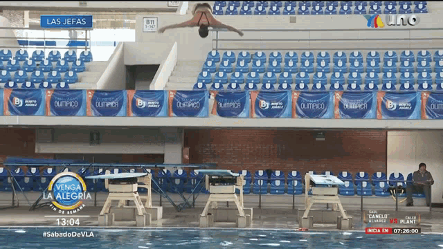 a swimming pool with a sign that says olympico