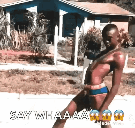 a woman in a bikini is dancing in front of a house with the words say whaaaa written on the bottom