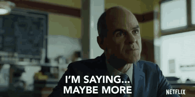 a man in a suit says i 'm saying maybe more