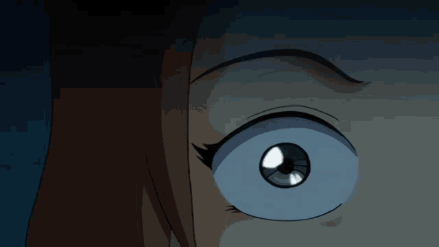 a close up of a girl 's eye with a blue pupil