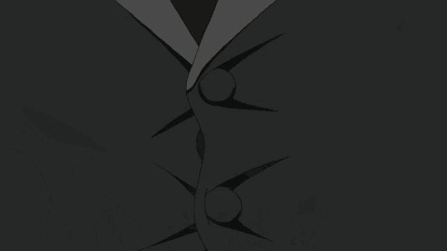 a boy in a tuxedo has a spider on his forehead