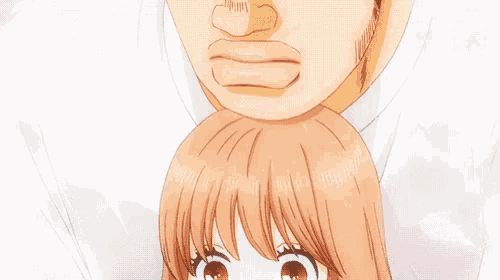 a close up of a girl 's face with a man 's head on top of her head .