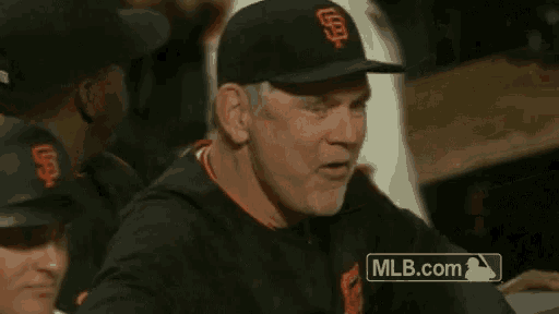 a man wearing a san francisco giants baseball cap