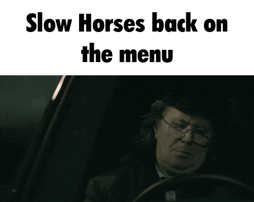 a man in a car with the words " slow horses back on the menu " above him