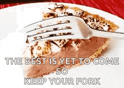 a slice of chocolate pie with a fork in it on a plate .