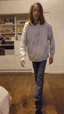 a girl wearing a white hoodie that says at & t