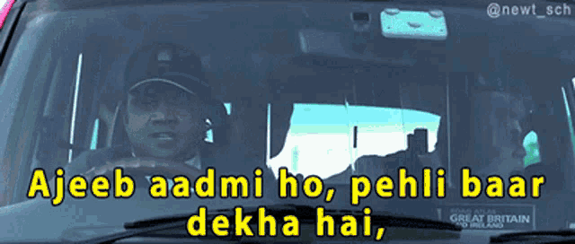 a man driving a car with the words ajeeb aadmi ho pehli baar dekha hai