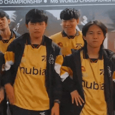 a group of young men wearing yellow nubia jerseys stand together