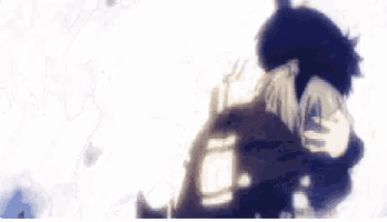a close up of a person holding another person 's arm in a dark room .