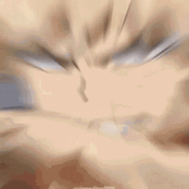 a close up of a person 's face with a blurry background and a blurry face .