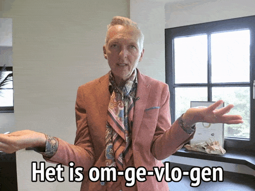 a man in a pink suit says het is om-ge-volo-gen