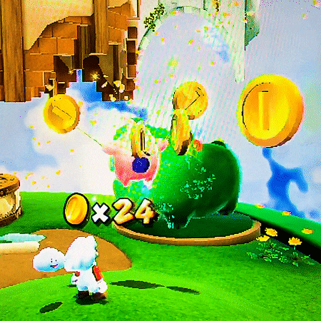 a video game screen shows a green frog with coins falling around it