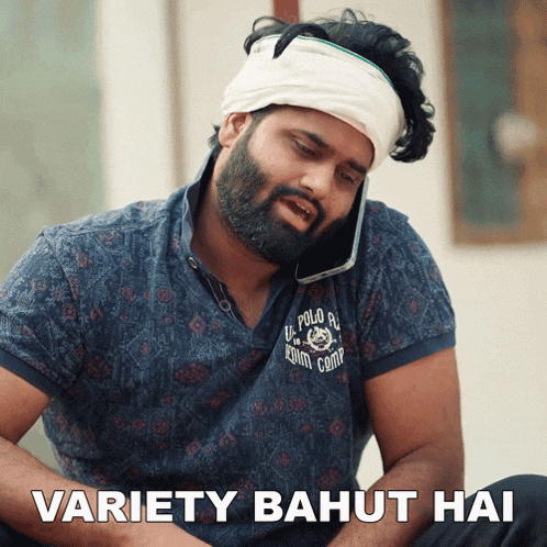 a man with a bandana on his head is talking on a cell phone with the caption variety bahut hai