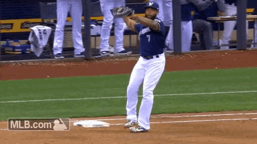 a baseball player wearing a number 7 jersey stands on the field