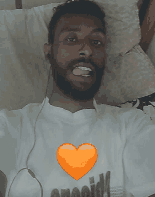 a man with a beard wearing a white shirt that says opioid on it