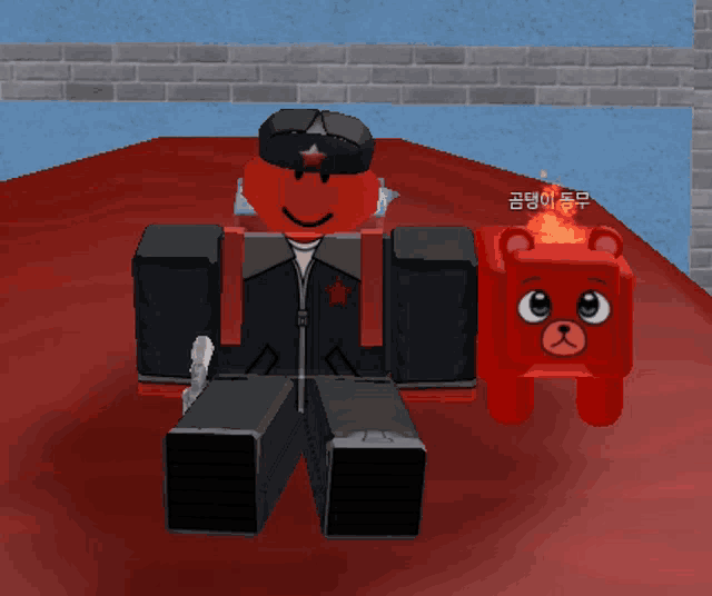a red cartoon character is sitting next to a red cartoon bear