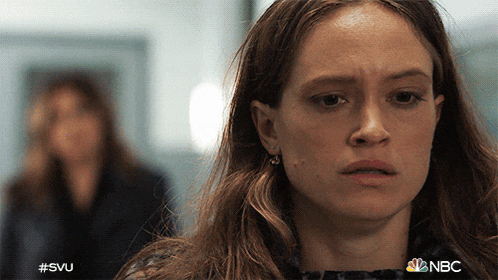a close up of a woman 's face with the hashtag #svu on the bottom