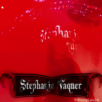 a woman stands in front of a sign that says stephanie vaquer on it