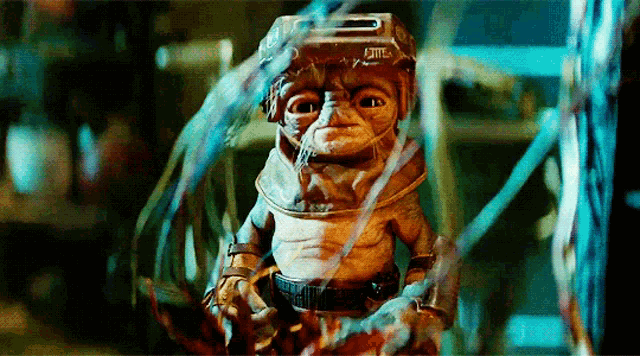 a close up of a cartoon character with a helmet that says ' elite ' on it