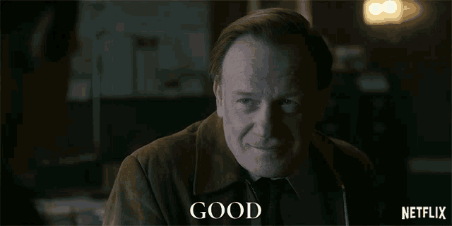 a man in a brown jacket and tie says good in a netflix ad