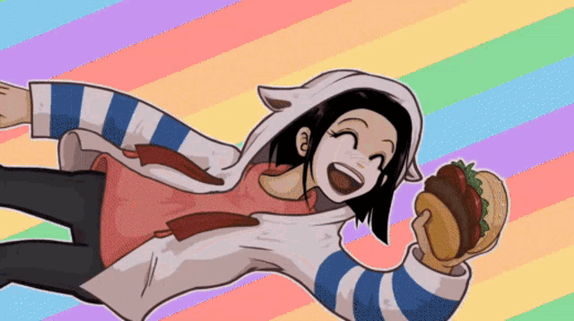 a girl in a striped shirt is holding a hamburger