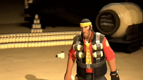 a man wearing a yellow headband is standing in front of a large barrel
