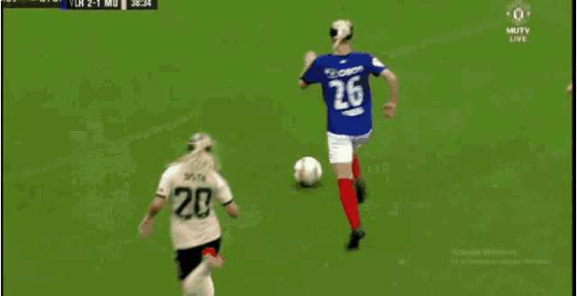a soccer game is being played on a tv screen