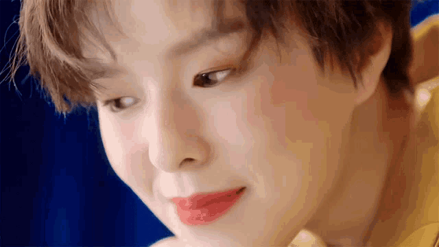 a close up of a person 's face with red lips