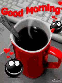a cup of coffee with a spoon in it and the words good morning written in red