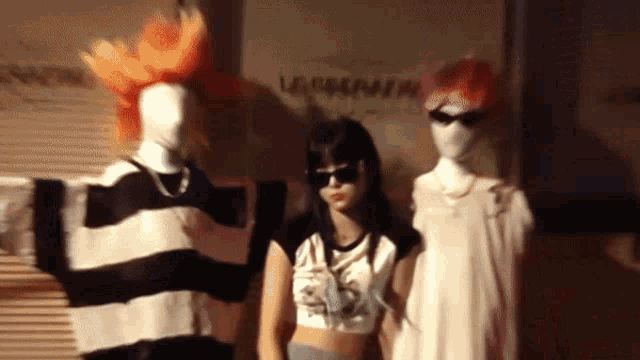 a group of mannequins are standing in front of a wall that says ' lavender '